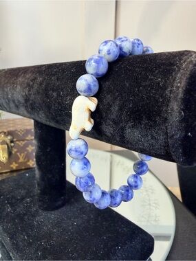 Fahlo Venture Bracelet featuring blue marbled beads and a white polar bear charm